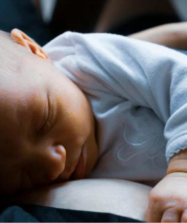 mother holding newborn baby